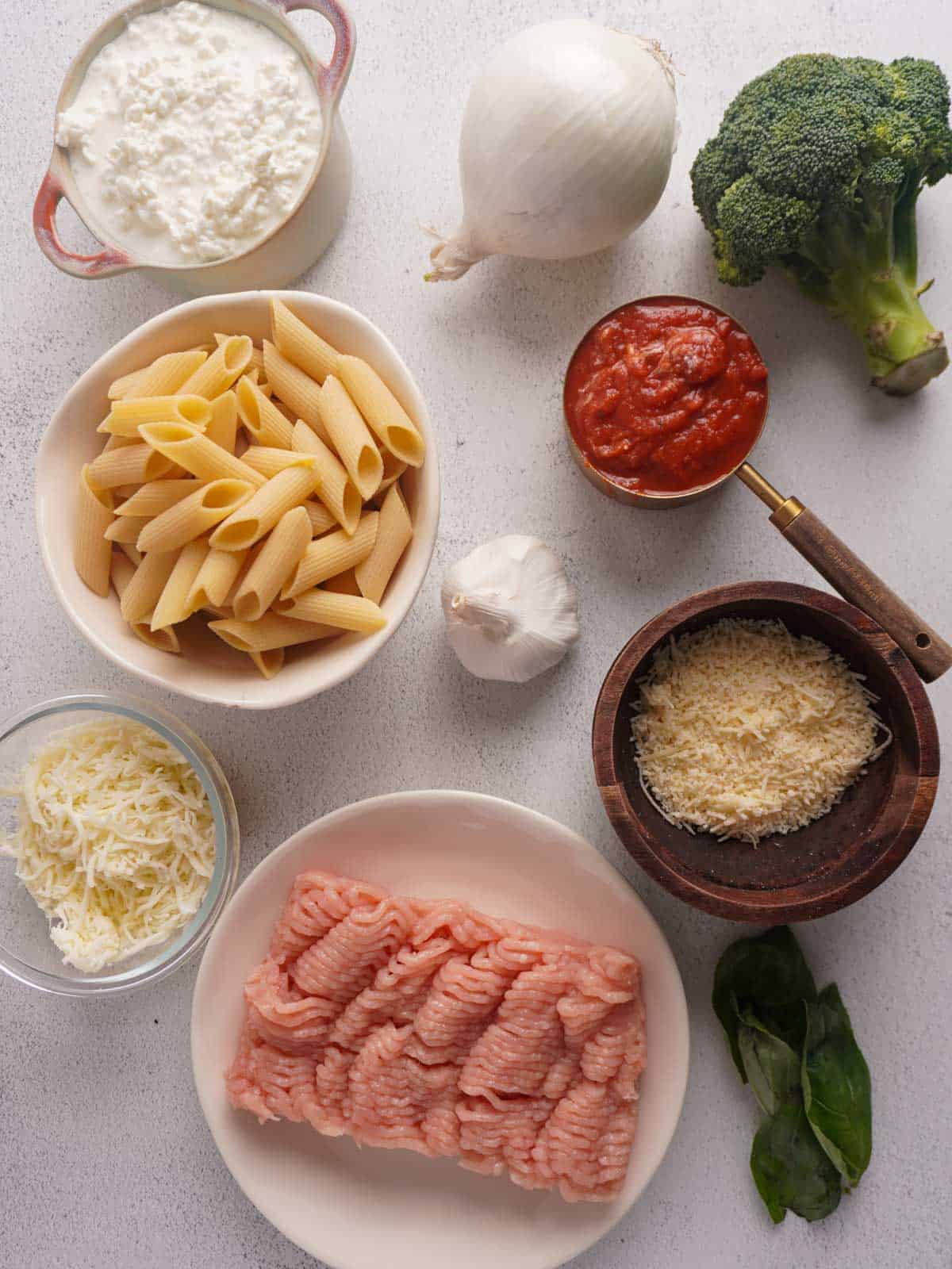 The ingredients lying flat on a table fie a cottage cheese pasta bake recipe.