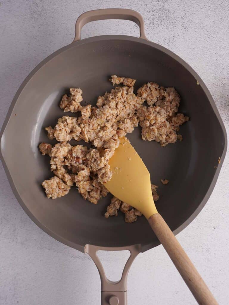 A skillet with scrambled oats, browned and cooked. 