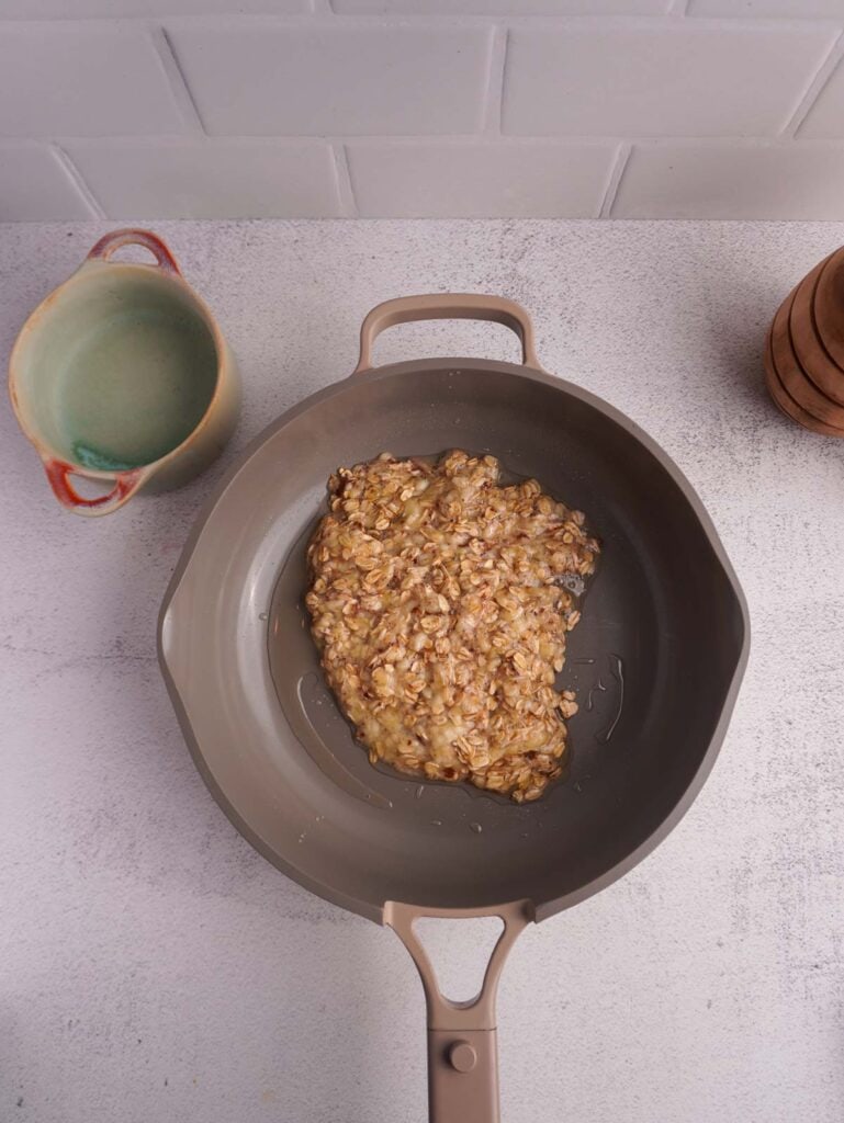 A skillet with scrambled oats.